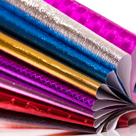 Metallic film lamination non woven